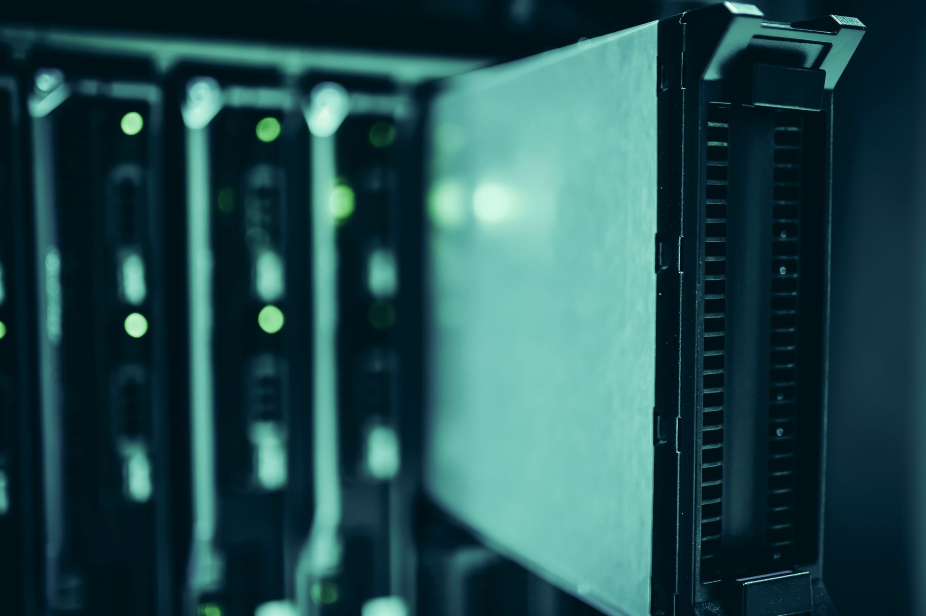 Servers glowing in dark datacenter indicating modern software integration
